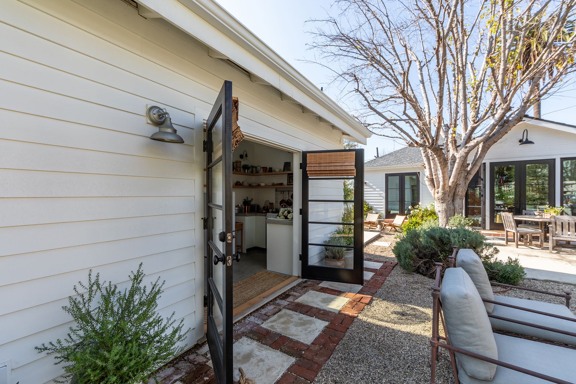 Light-colored Savannah Smooth on residence with doors open